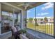 Relaxing screened balcony with ceiling fan, comfortable seating, and views of the manicured community at 7021 Della Dr # 52, Orlando, FL 32819