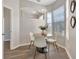 Cozy dining nook featuring a bay window, modern light fixture, and seating for four at 7021 Della Dr # 52, Orlando, FL 32819