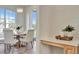 Dining room featuring a round wood table with modern chandelier and backyard view at 7021 Della Dr # 52, Orlando, FL 32819