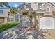 Charming front entrance featuring a white door, tiled entry, and well-maintained landscaping at 7021 Della Dr # 52, Orlando, FL 32819