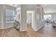 Open hallway leading to the dining room, showcasing stylish design and neutral color palette at 7021 Della Dr # 52, Orlando, FL 32819