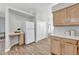 Bright kitchen featuring white refrigerator, white appliances, and wooden cabinets at 7021 Della Dr # 52, Orlando, FL 32819