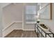 Hallway landing with natural light, console table, and modern decor at 7021 Della Dr # 52, Orlando, FL 32819
