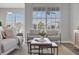 Comfortable living area with large windows, neutral decor, and an open dining space at 7021 Della Dr # 52, Orlando, FL 32819