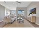 Bright living room featuring neutral tones, natural light, and open floor plan at 7021 Della Dr # 52, Orlando, FL 32819