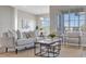 Comfortable living room features large windows, a ceiling fan, and a seamless transition to the adjacent dining area at 7021 Della Dr # 52, Orlando, FL 32819