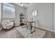 Home office features a modern desk, natural light, and comfortable chair at 7021 Della Dr # 52, Orlando, FL 32819