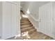 Bright stairway with wood flooring, white trim, and a clean, modern design at 7021 Della Dr # 52, Orlando, FL 32819