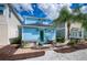 Private backyard features a hot tub, patio table and chairs, and lounge chairs for relaxing at 8044 Dreamsicle Dr, Kissimmee, FL 34747