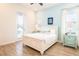 Comfortable bedroom features a queen-size bed, tile floors, and lots of natural light at 8044 Dreamsicle Dr, Kissimmee, FL 34747