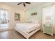 Inviting bedroom with a king-size bed, tile floors, and neutral decor and an exit to the outside at 8044 Dreamsicle Dr, Kissimmee, FL 34747