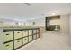 Bright bonus room provides extra storage and shelving with neutral carpet and paint at 8555 Abbotsbury Dr, Windermere, FL 34786