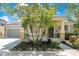 Charming home featuring a well-manicured lawn, complemented by three palm trees and a classic gray facade at 8555 Abbotsbury Dr, Windermere, FL 34786