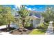 Beautiful two story home with tidy landscaping and an inviting front entrance, showcasing a harmonious blend of colors and textures at 8555 Abbotsbury Dr, Windermere, FL 34786
