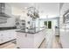 Modern kitchen featuring a large island, stainless steel appliances, and ample counter space, perfect for cooking and entertaining at 8555 Abbotsbury Dr, Windermere, FL 34786