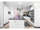 Modern kitchen featuring a large island, stainless steel appliances, and ample counter space, perfect for cooking and entertaining at 8555 Abbotsbury Dr, Windermere, FL 34786