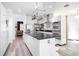 Modern kitchen featuring a large island, stainless steel appliances, and ample counter space, perfect for cooking and entertaining at 8555 Abbotsbury Dr, Windermere, FL 34786