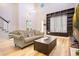 Bright living room boasting high ceilings, with elegant decor and comfortable seating around the wooden coffee table at 8555 Abbotsbury Dr, Windermere, FL 34786