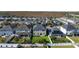Aerial view of the home and backyard in a neighborhood with many other homes with green lawns at 8565 Tallfield Ave # 1, Orlando, FL 32832