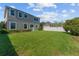 Large backyard showcasing a manicured lawn, privacy fence, and a well-maintained exterior at 8565 Tallfield Ave # 1, Orlando, FL 32832
