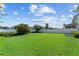 Beautiful backyard with lush lawn and white privacy fence at 8565 Tallfield Ave # 1, Orlando, FL 32832