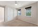 Bedroom featuring a ceiling fan and windows offering natural light and views at 8565 Tallfield Ave # 1, Orlando, FL 32832