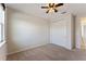 Bedroom with a ceiling fan, closet, and carpeted floors at 8565 Tallfield Ave # 1, Orlando, FL 32832