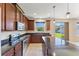 Well-appointed kitchen features stainless steel appliances, dark granite countertops, and a large island for food preparation at 8565 Tallfield Ave # 1, Orlando, FL 32832