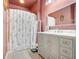 The bathroom features a vanity with a marble counter, gray cabinets, and a shower with a tub at 860 N Orange Ave # 226, Orlando, FL 32801