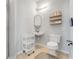 Bathroom offering a sink, toilet, and a tiled shower with glass doors at 860 N Orange Ave # 226, Orlando, FL 32801