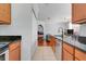 This is a kitchen that features wooden cabinets, granite counter tops and stainless steel appliances at 860 N Orange Ave # 226, Orlando, FL 32801