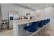 Well-appointed kitchen with a large island, stainless steel appliances, and white cabinetry offering ample storage at 8953 Amelia Downs Trl, Kissimmee, FL 34747