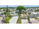 Stunning aerial view of a well-maintained community, surrounded by mature trees and manicured lawns on a sunny day at 9000 Us Highway 192 # 624, Clermont, FL 34714
