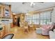 Cozy dining area with hardwood floors, traditional cabinets, and natural light from the window at 9000 Us Highway 192 # 624, Clermont, FL 34714