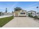 Charming single-Gathering home featuring a large driveway, manicured lawn, and welcoming curb appeal at 9000 Us Highway 192 # 624, Clermont, FL 34714