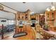 Efficient kitchen with wooden cabinetry, essential appliances, and seamless flow to the dining area at 9000 Us Highway 192 # 624, Clermont, FL 34714