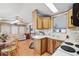 Efficient kitchen and dining area with wood cabinets, standard appliances and bright interiors at 9000 Us Highway 192 # 624, Clermont, FL 34714