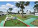 Fun mini-golf course with challenging obstacles and lush landscaping surrounded by mature palm trees on a sunny day at 9000 Us Highway 192 # 624, Clermont, FL 34714