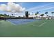 Well-kept tennis courts for recreational use under a sunny sky, ideal for active residents at 9000 Us Highway 192 # 624, Clermont, FL 34714