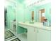 Bathroom featuring a vanity with ample counter space and large mirrors at 9311 Sonia St, Orlando, FL 32825