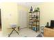 The bedroom has neutral walls, closet, storage shelving, and a window at 9311 Sonia St, Orlando, FL 32825