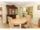 Spacious dining room with classic china cabinet and adjacent living area at 9311 Sonia St, Orlando, FL 32825
