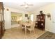 Dining area featuring a table with seating for four, adjacent to the living room at 9311 Sonia St, Orlando, FL 32825
