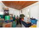 Enclosed Florida Room filled with boxes, storage containers and furniture at 9311 Sonia St, Orlando, FL 32825