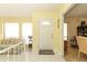 Bright foyer with tile floors, large windows, and a view of the living and dining areas at 9311 Sonia St, Orlando, FL 32825