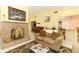 Inviting living room with fireplace and views into the dining area and kitchen at 9311 Sonia St, Orlando, FL 32825