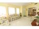 Bright living room featuring large windows, open floor plan with furniture, and neutral decor at 9311 Sonia St, Orlando, FL 32825