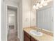 Bathroom with tile floor, granite counter and vanity at 970 Timberview Rd, Clermont, FL 34715