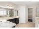 Large bathroom with double sinks, a walk-in shower, and an adjacent walk-in closet at 970 Timberview Rd, Clermont, FL 34715