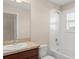 Bathroom with combination tub/shower, white tile, and single sink vanity at 970 Timberview Rd, Clermont, FL 34715